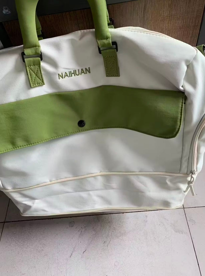 A buyer's photo of the White-Green duffel standing on a tiled floor