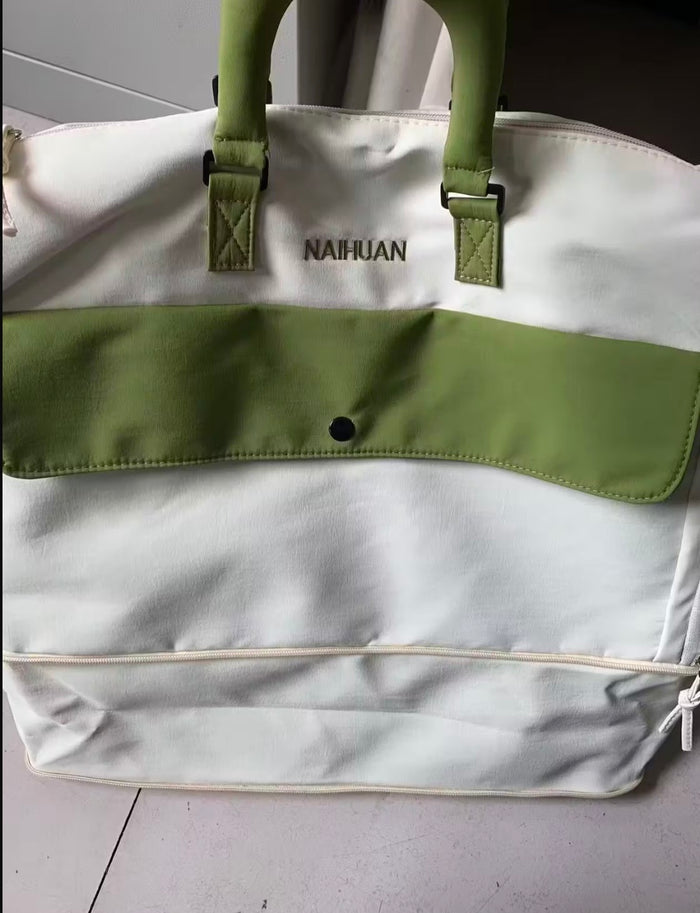 The same buyer's closer photo of the White-Green duffel's front