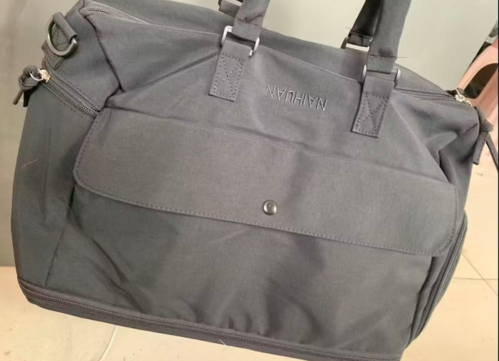 A buyer's photo of the Black duffel showing the front flap and snap