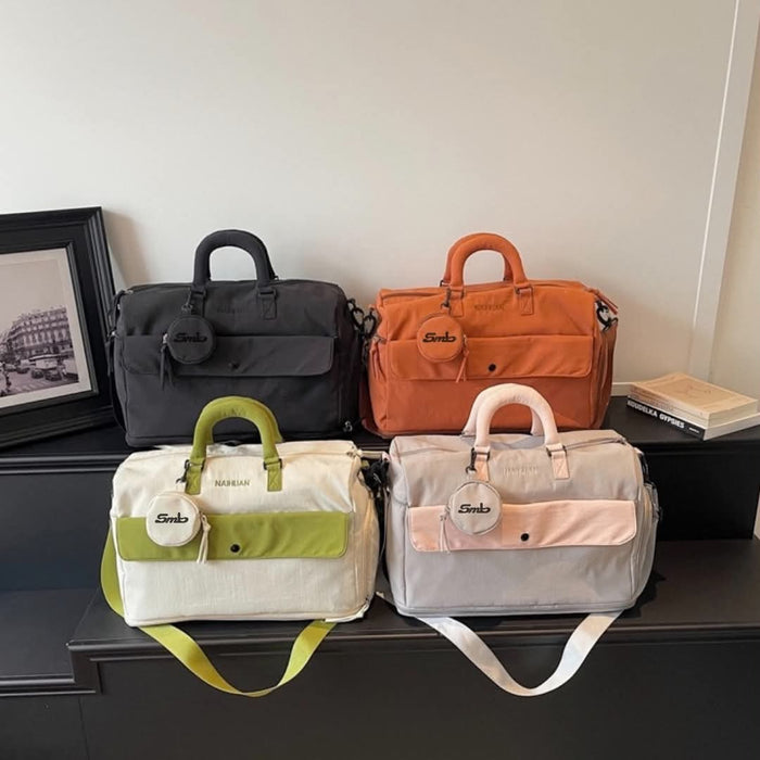 The Orange duffel beside a house plant