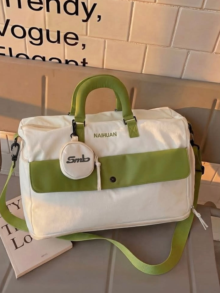 The White-Green duffel against a tiled wall