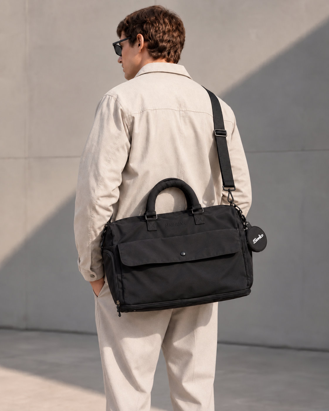 Black — Sports Duffel Bag carried on the shoulder with the adjustable strap