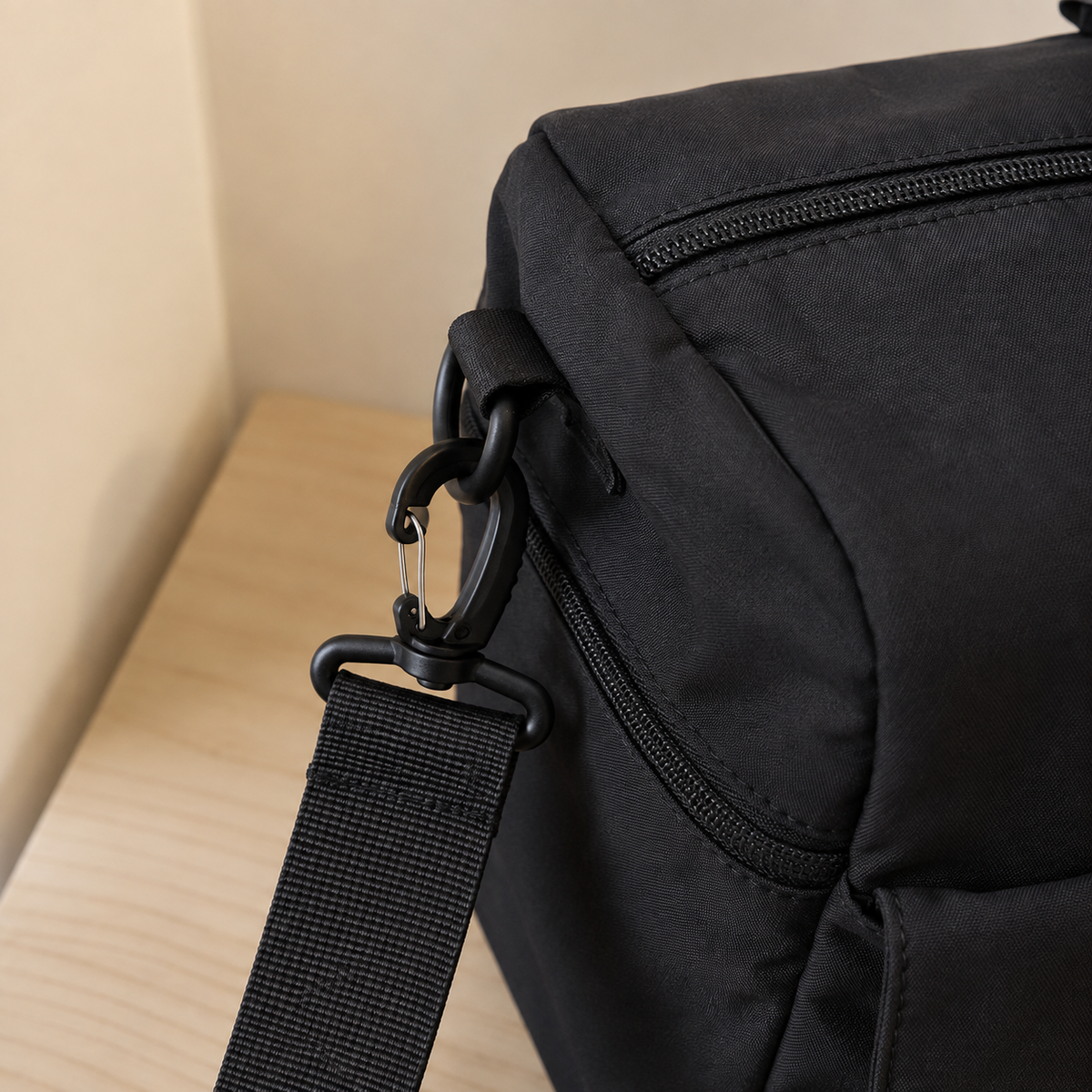 Black — Sports Duffel Bag, close-up of the webbing shoulder strap and swivel clip hardware
