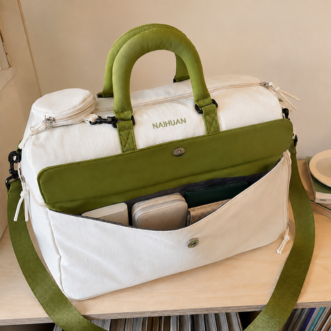 White-Green — Sports Duffel Bag, front flap pocket open with a zip pouch, wallet and small case inside