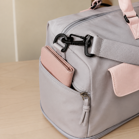 Grey-Pink — Sports Duffel Bag, close-up of the snap-front flap, strap and round pouch