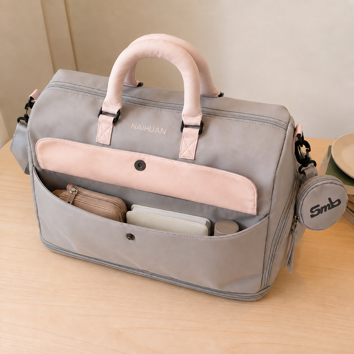 Grey-Pink — Sports Duffel Bag, front flap pocket open with a zip pouch, wallet and small case inside
