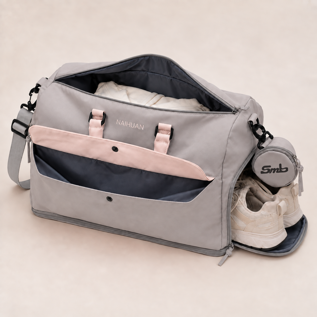 Grey-Pink — Sports Duffel Bag, folded clothes in the main compartment and trainers in the separate shoe compartment