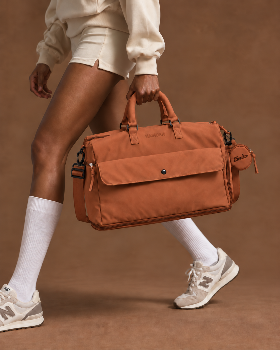 Orange — Sports Duffel Bag carried by the top handles