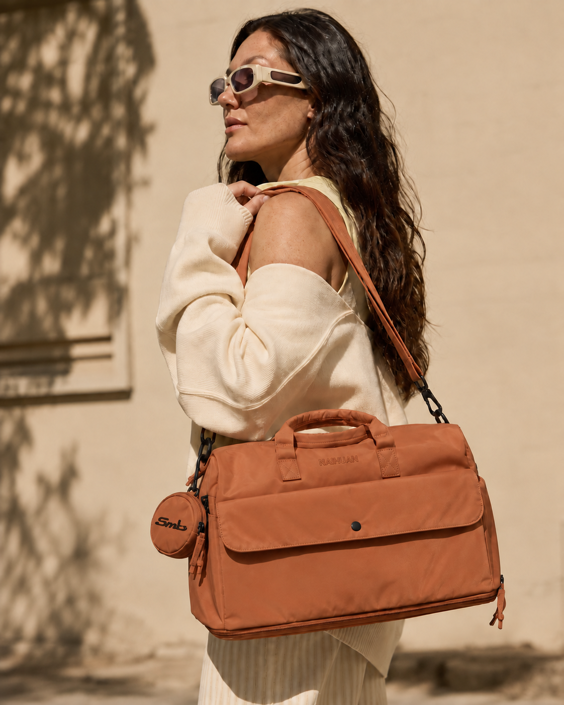 Orange — Sports Duffel Bag carried on the shoulder with the adjustable strap