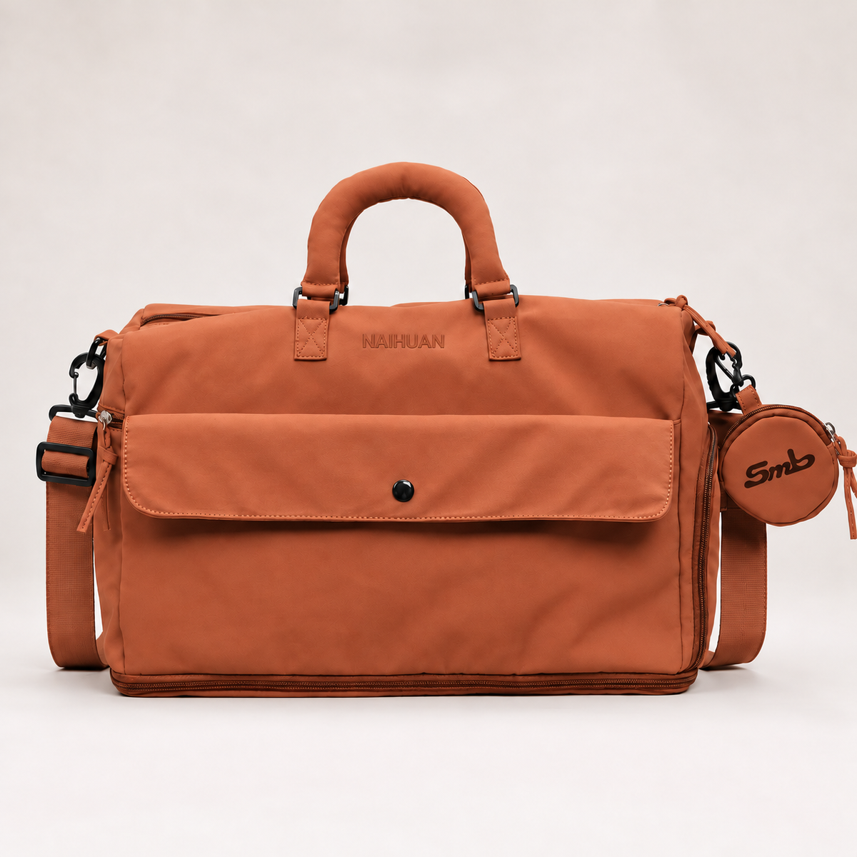 Orange — Sports Duffel Bag, front view with the detachable round pouch clipped to the strap