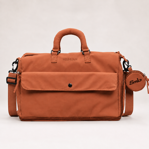 Orange — Sports Duffel Bag, front view with the detachable round pouch clipped to the strap