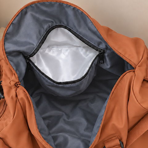 Orange — Sports Duffel Bag, looking down into the open main compartment showing the lined interior and internal pockets