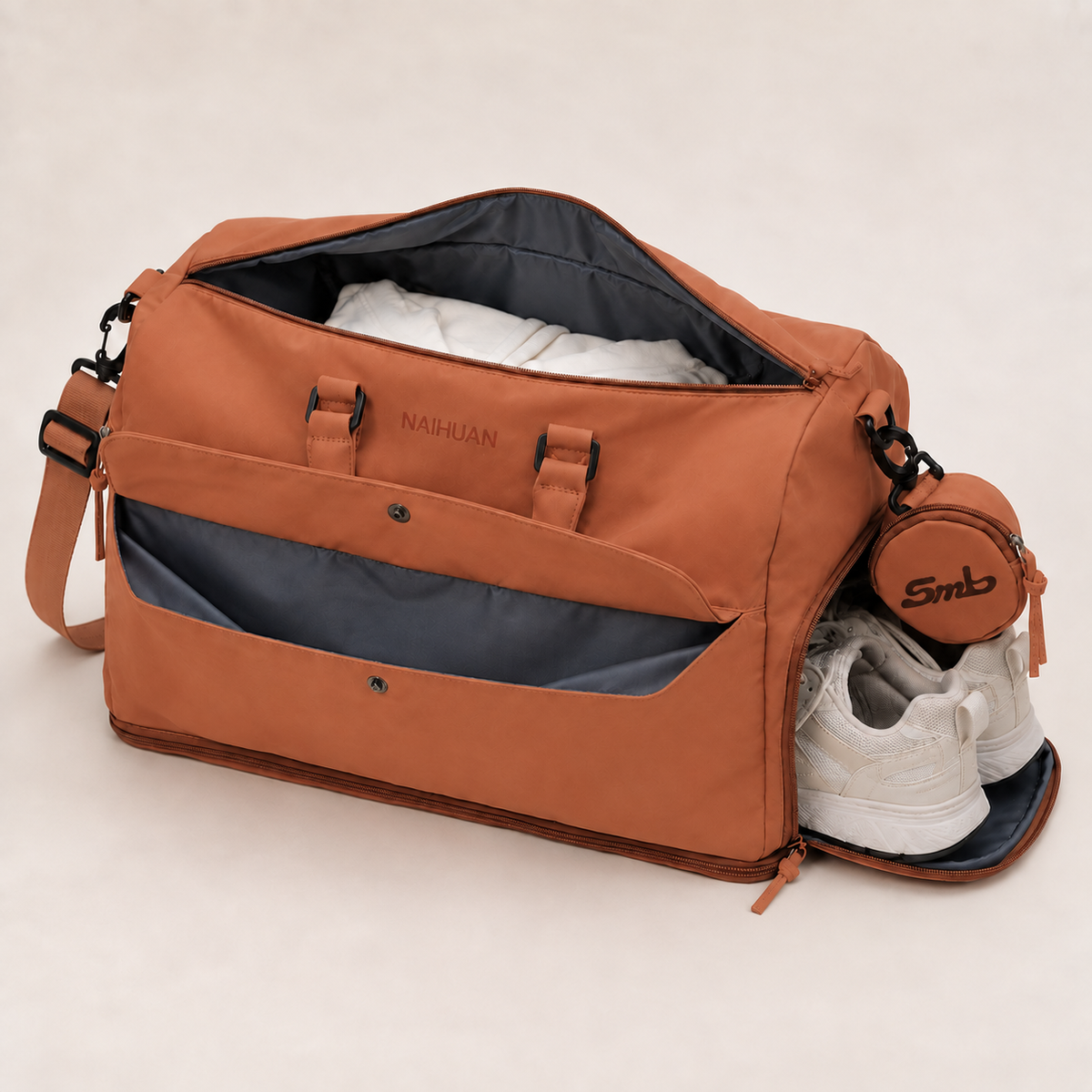 Orange — Sports Duffel Bag on a shelf, side shoe compartment open with trainers stowed away from the main compartment