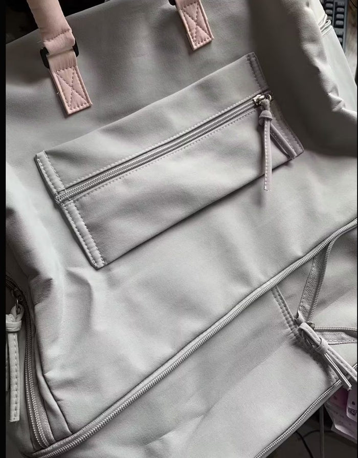 The same buyer's close-up of the zipped front pocket and stitching